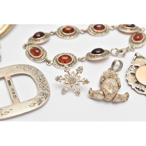 106 - AN ASSORTMENT OF SILVER AND WHITE METAL JEWELLERY, to include a silver buckle, a silver teddy bear p... 