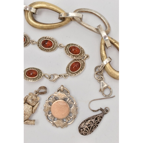 106 - AN ASSORTMENT OF SILVER AND WHITE METAL JEWELLERY, to include a silver buckle, a silver teddy bear p... 