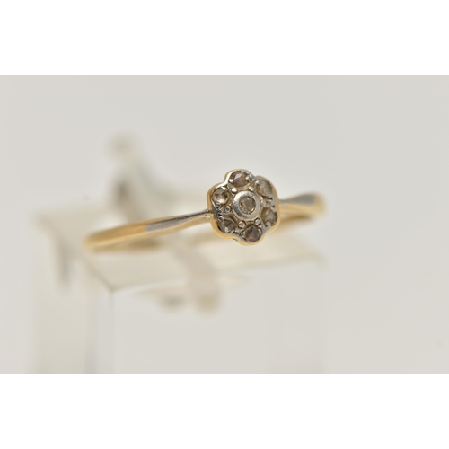 11 - A YELLOW AND WHITE METAL DIAMOND CLUSTER RING, small flower cluster, set with rose cut diamonds, in ... 