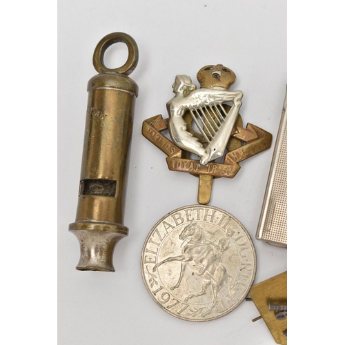 113 - AN ASSORTMENT OF MILITARY ITEMS, to include pins and cap badges, a whistle also including a lighter ... 