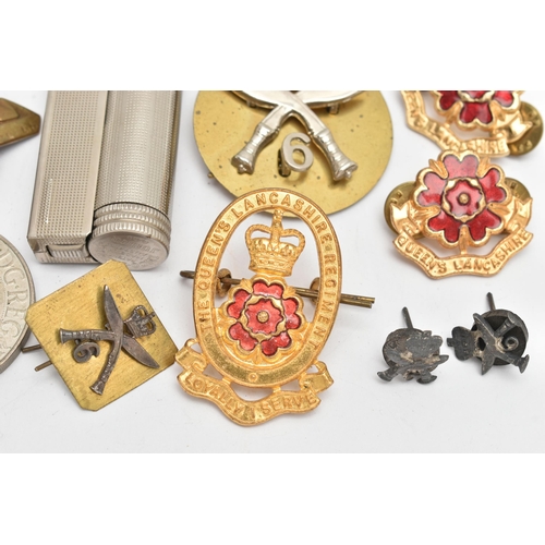 113 - AN ASSORTMENT OF MILITARY ITEMS, to include pins and cap badges, a whistle also including a lighter ... 