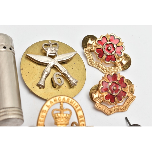 113 - AN ASSORTMENT OF MILITARY ITEMS, to include pins and cap badges, a whistle also including a lighter ... 