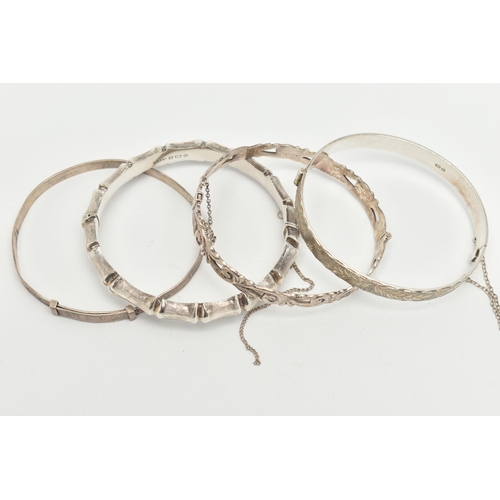 116 - THREE SILVER BANGLES, the first a bamboo style hinged bangle, the second an open work foliage hinged... 