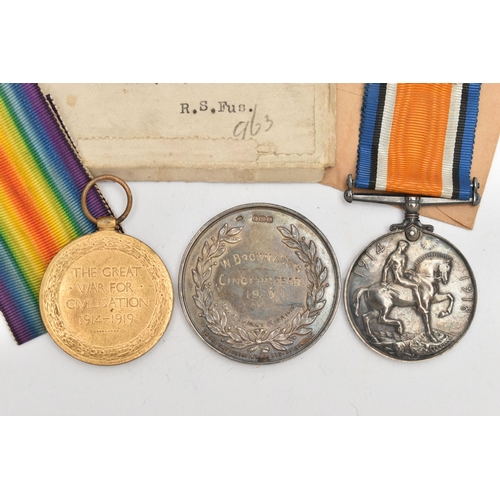 121 - TWO WORLD WAR ONE MEDALS AND A SILVER MEDALLION, to include a WWI medal fitted with a ribbon, assign... 