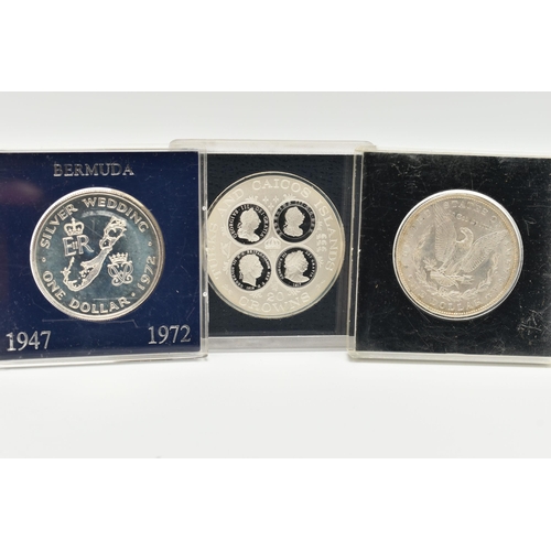 123 - THREE CASED COINS, to include a 1977 Elizabeth II Turkes and Caicos Island 20 Crowns coin, a United ... 