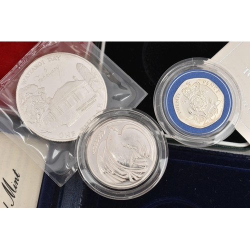 128 - THREE CASED COINS, to include a 'United Kingdom Proof Silver Piedfort Twenty-Pence 1982' with COA, a... 