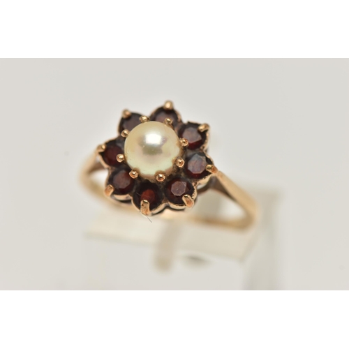 14 - A YELLOW METAL PEARL AND GARNET CLUSTER RING, centring on a single cultured pearl claw set within a ... 