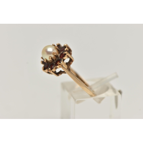 14 - A YELLOW METAL PEARL AND GARNET CLUSTER RING, centring on a single cultured pearl claw set within a ... 