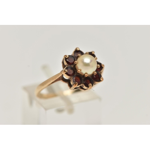 14 - A YELLOW METAL PEARL AND GARNET CLUSTER RING, centring on a single cultured pearl claw set within a ... 