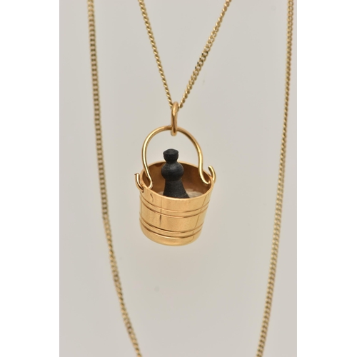 15 - A 9CT GOLD PENDANT AND CHAIN, the pendant in the form of a champagne bucket with a plastic champagne... 