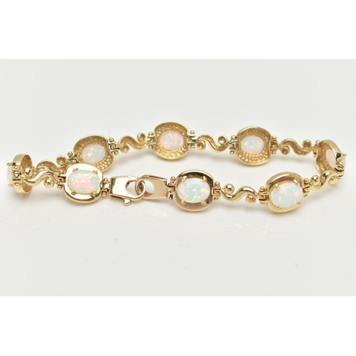 2 - A YELLOW METAL, SYNTHETIC OPAL LINE BRACELET, designed as a series of eight synthetic opal cabochons... 