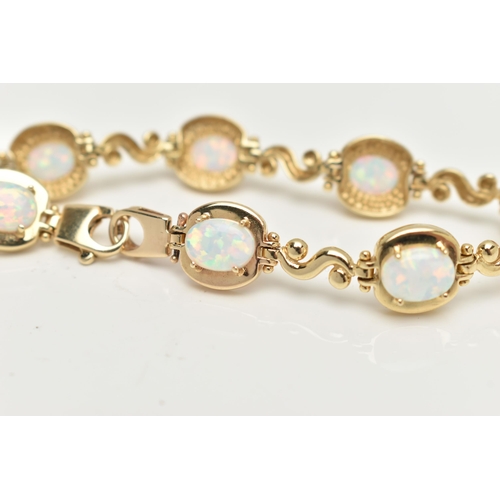 2 - A YELLOW METAL, SYNTHETIC OPAL LINE BRACELET, designed as a series of eight synthetic opal cabochons... 