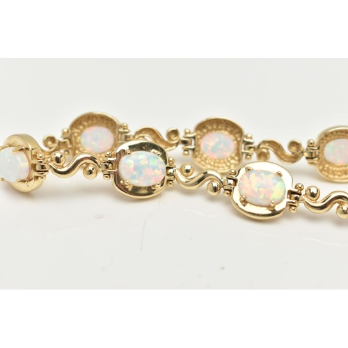 2 - A YELLOW METAL, SYNTHETIC OPAL LINE BRACELET, designed as a series of eight synthetic opal cabochons... 