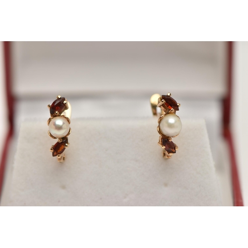 23 - A PAIR OF YELLOW METAL GARNET AND PEARL EARRINGS, each earring set with a single cultured pearl betw... 