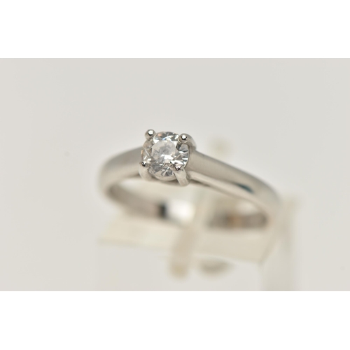 26 - A SINGLE STONE DIAMOND PLATINUM RING, the brilliant cut diamond within a four claw setting to the pl... 