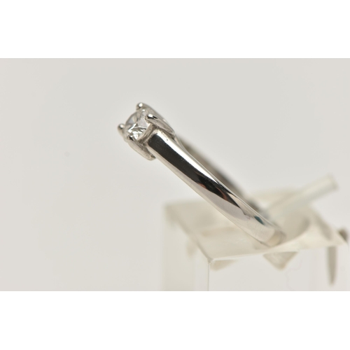 26 - A SINGLE STONE DIAMOND PLATINUM RING, the brilliant cut diamond within a four claw setting to the pl... 