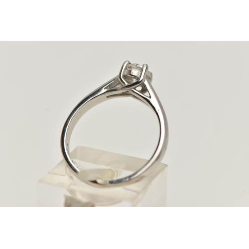 26 - A SINGLE STONE DIAMOND PLATINUM RING, the brilliant cut diamond within a four claw setting to the pl... 