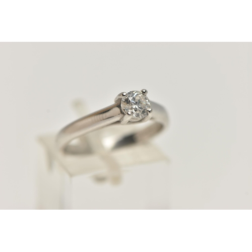 26 - A SINGLE STONE DIAMOND PLATINUM RING, the brilliant cut diamond within a four claw setting to the pl... 