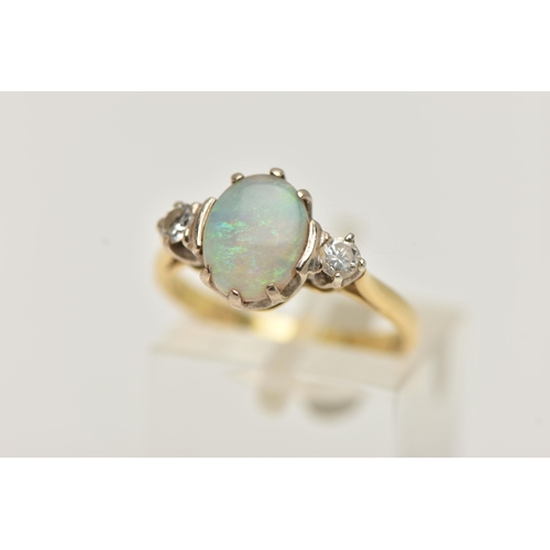 27 - AN 18CT GOLD OPAL AND DIAMOND RING, designed as a central oval opal flanked by brilliant cut diamond... 