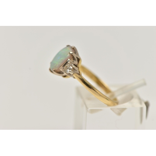 27 - AN 18CT GOLD OPAL AND DIAMOND RING, designed as a central oval opal flanked by brilliant cut diamond... 