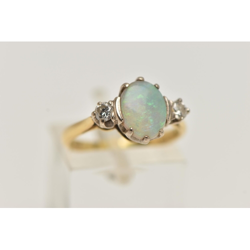 27 - AN 18CT GOLD OPAL AND DIAMOND RING, designed as a central oval opal flanked by brilliant cut diamond... 