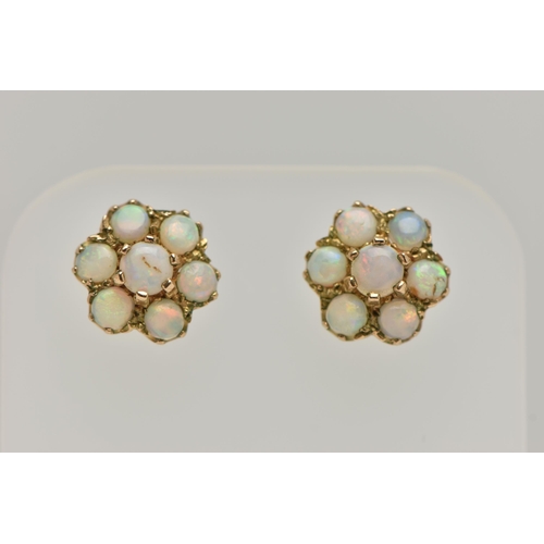 28 - A PAIR OF GOLD OPAL CLUSTER EAR STUDS, designed as seven circular opal cabochons claw set in a clust... 