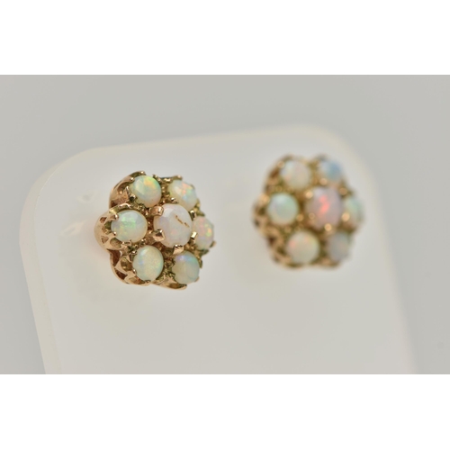 28 - A PAIR OF GOLD OPAL CLUSTER EAR STUDS, designed as seven circular opal cabochons claw set in a clust... 