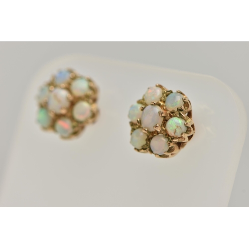 28 - A PAIR OF GOLD OPAL CLUSTER EAR STUDS, designed as seven circular opal cabochons claw set in a clust... 