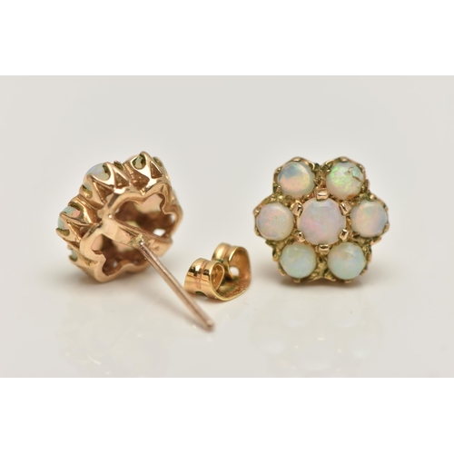 28 - A PAIR OF GOLD OPAL CLUSTER EAR STUDS, designed as seven circular opal cabochons claw set in a clust... 