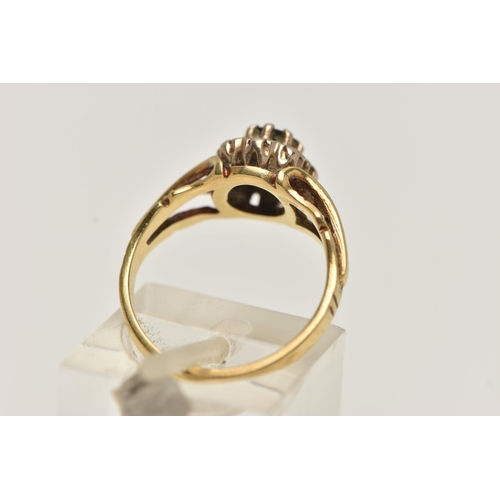 36 - AN 18CT GOLD SAPPHIRE AND DIAMOND CLUSTER RING, designed as a central circular sapphire within a sin... 