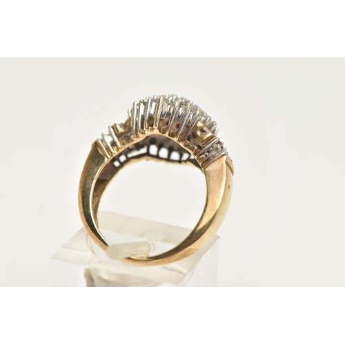 63 - A DIAMOND CLUSTER RING, a yellow metal diamond cluster ring, tapered shoulders to a plain polished b... 