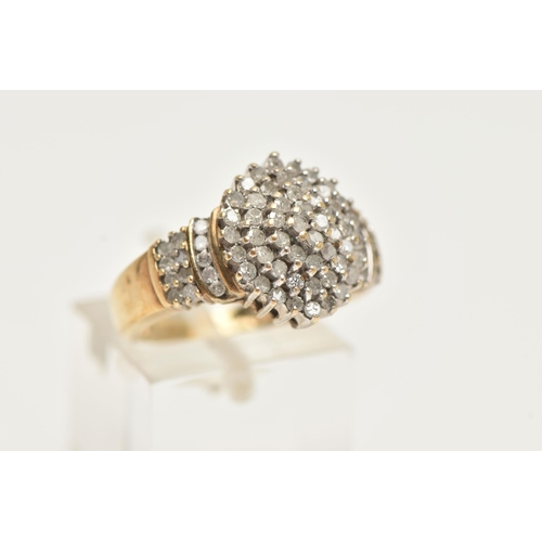 63 - A DIAMOND CLUSTER RING, a yellow metal diamond cluster ring, tapered shoulders to a plain polished b... 