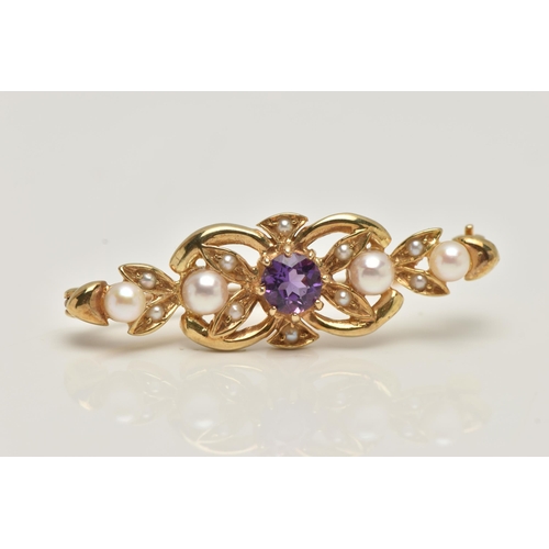 76 - A 9CT GOLD AMETHYST AND SEED PEARL BROOCH, open work brooch set with a central circular cut amethyst... 