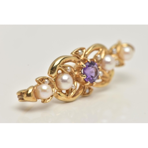 76 - A 9CT GOLD AMETHYST AND SEED PEARL BROOCH, open work brooch set with a central circular cut amethyst... 