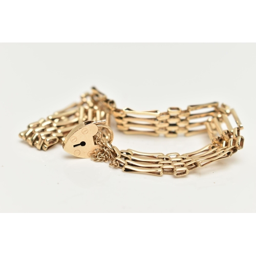 8 - A 9CT GOLD GATE BRACELET, four bar gate bracelet, fitted with a heart padlock clasp, with additional... 