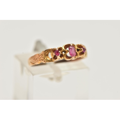 84 - A GEM SET RING, an oval cut pink paste stone with two round cut spinels, prong set in yellow metal, ... 