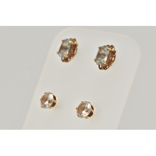 89 - TWO PAIRS OF EAR STUDS, the first designed as an oval blue topaz within a four claw setting with a s... 