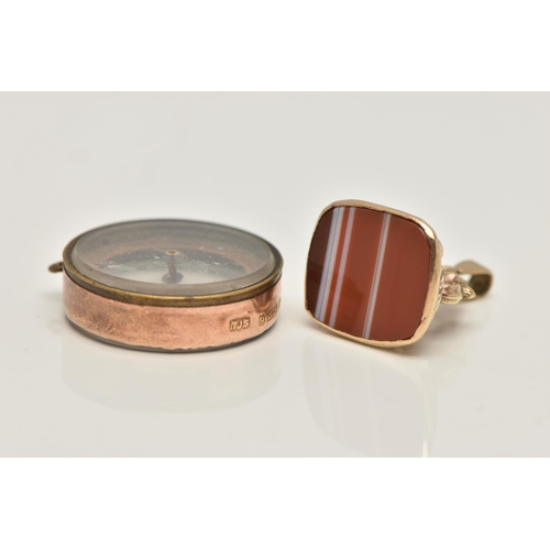 91 - TWO 9CT GOLD ITEMS, to include an agate set fob with scrolling detail, with gold hallmark, together ... 