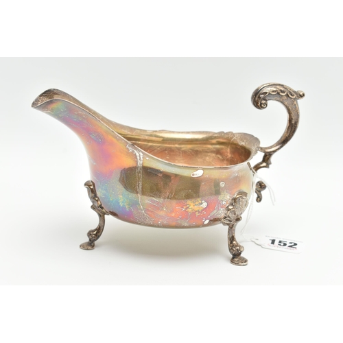 152 - A GEORGE V SILVER SAUCE BOAT, wavy rim S scroll handle on four cabriole legs with hoof feet and shel... 