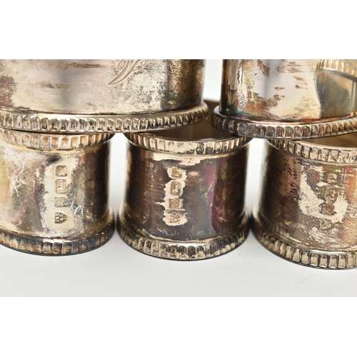 153 - A SET OF EIGHT ELIZABETH II OVAL SILVER NAPKIN RINGS, fluted rims, all engraved with initial 'A', ma... 