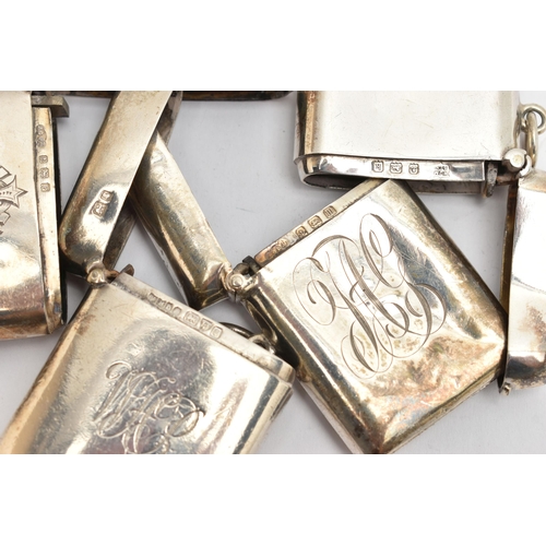 157 - FOUR EDWARDIAN / GEORGE V SILVER VESTA CASES OF RECTANGULAR FORM, all plain with engraved initials /... 