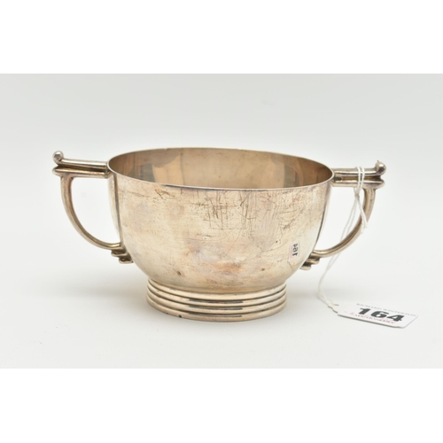 164 - A GEORGE VI SILVER TWIN HANDLED PORRIDGE BOWL, with angular handles and ribbed foot, makers James Di... 