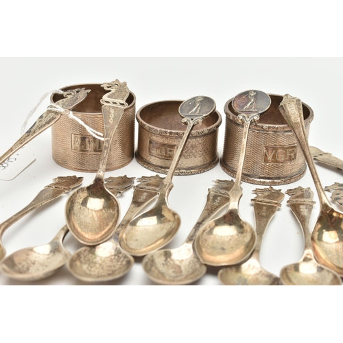 166 - A PARCEL OF SILVER GOLFING TEASPOONS AND THREE ELIZABETH II CIRCULAR SILVER NAPKIN RINGS, the teaspo... 