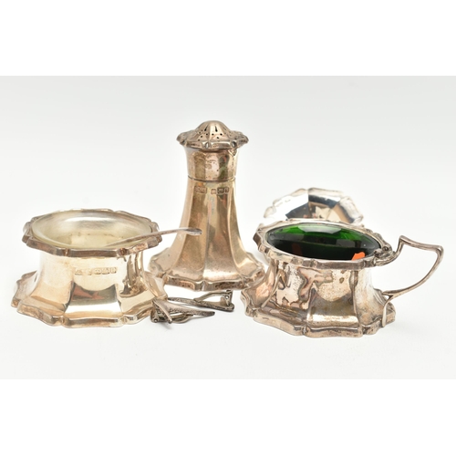 171 - A THREE PIECE SILVER CONDIMENT SET, comprising of a mustard with green glass insert and broken cover... 