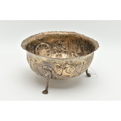 173 - A LATE VICTORIAN SILVER BOWL, with wavy rim, repoussé decorated with foliate scrolls, birds and beas... 