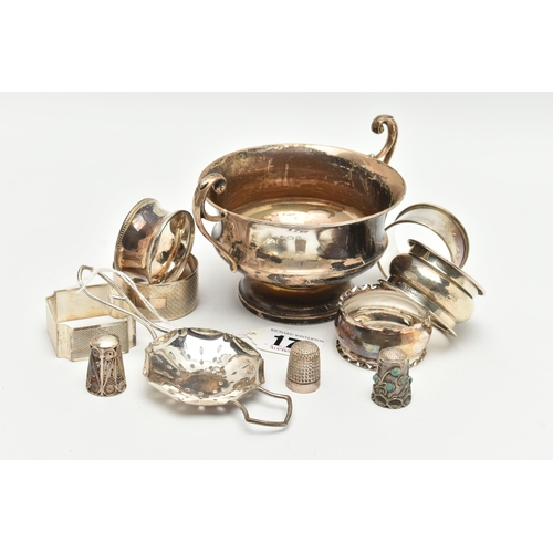 176 - A SMALL PARCEL OF SILVER, comprising six assorted  napkin rings, a late Victorian thimble, a George ... 