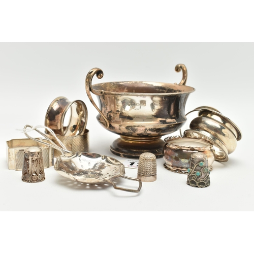 176 - A SMALL PARCEL OF SILVER, comprising six assorted  napkin rings, a late Victorian thimble, a George ... 