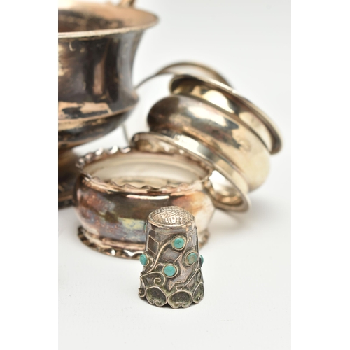 176 - A SMALL PARCEL OF SILVER, comprising six assorted  napkin rings, a late Victorian thimble, a George ... 