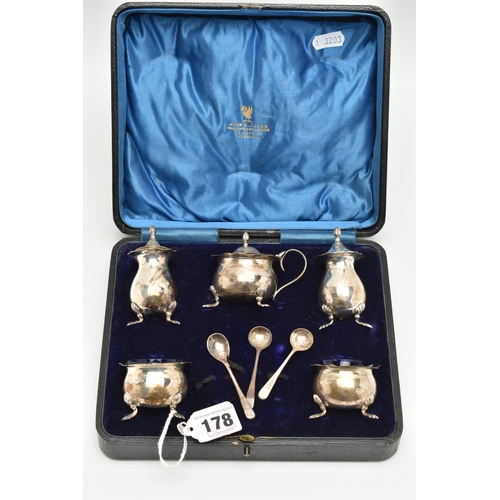 178 - A CASED GEORGE V SILVER FIVE PIECE CRUET SET AND THREE CONDIMENT SPOONS, the cruet set comprising a ... 