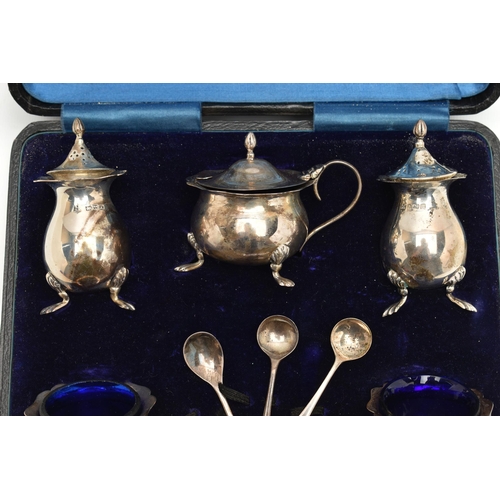 178 - A CASED GEORGE V SILVER FIVE PIECE CRUET SET AND THREE CONDIMENT SPOONS, the cruet set comprising a ... 